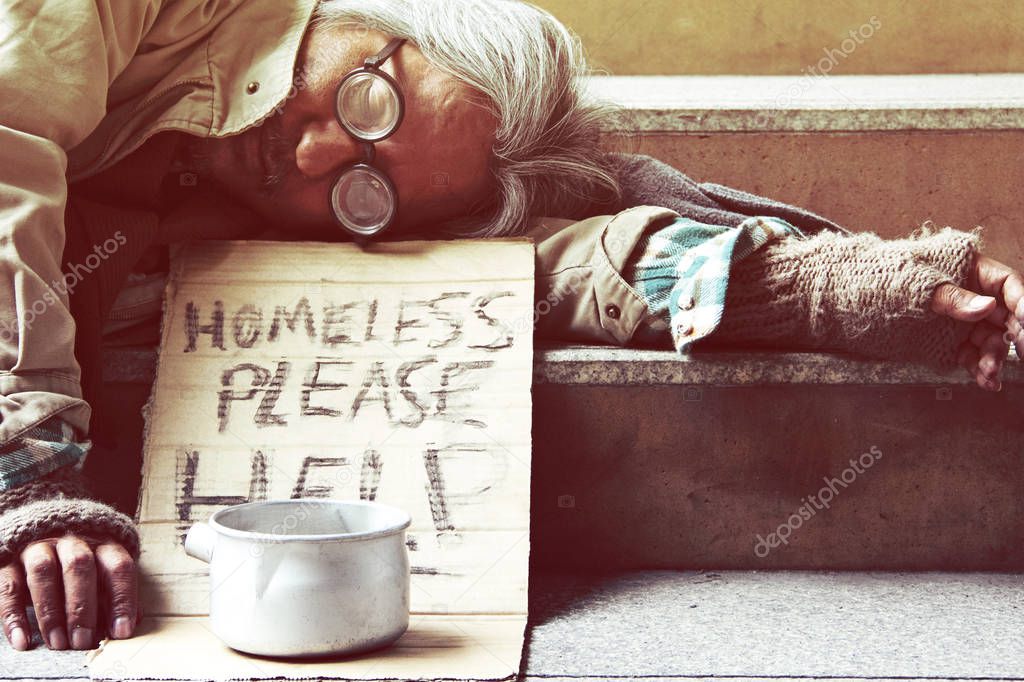 Could you please help homeless man sleeping on walkway street in the capticap city.