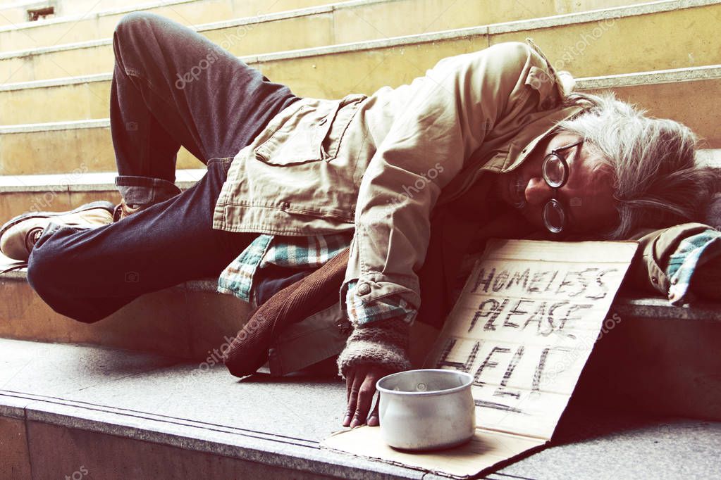Beautiful Homeless man on walkway street, Homeless concept.