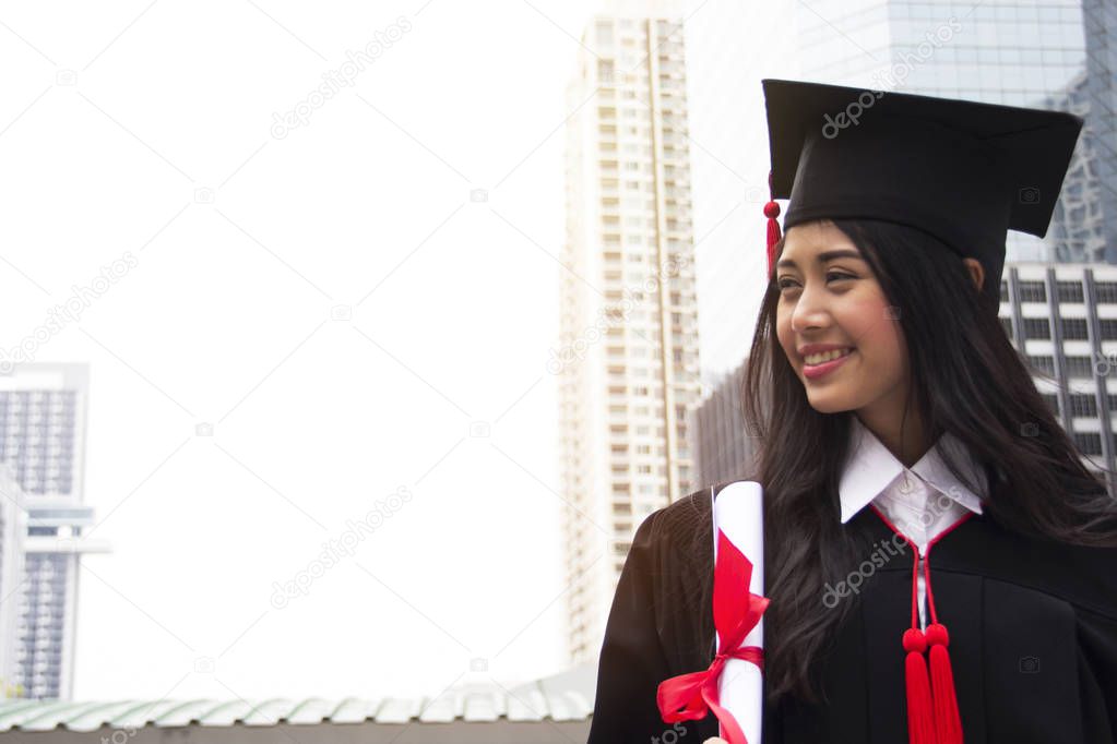 Beautiful Graduate graduates woman smile and are happy after graduation.