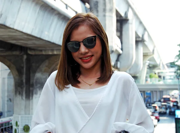 Beautiful woman smile portrait traveling and walking street in the city.