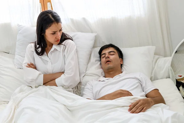 Wife can\'t sleep Because the husband snores loudly on bedroom in morning.