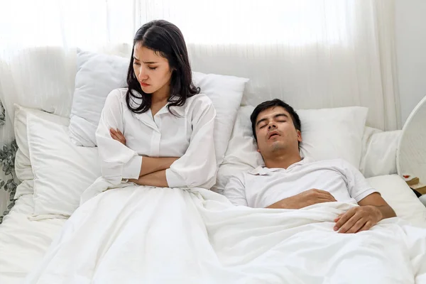 Wife can\'t sleep Because the husband snores loudly on bedroom in morning.