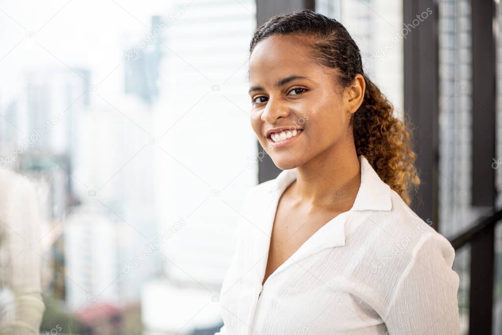 Beautiful happiness African business woman smile portrait in the office for lifestyle new normal.