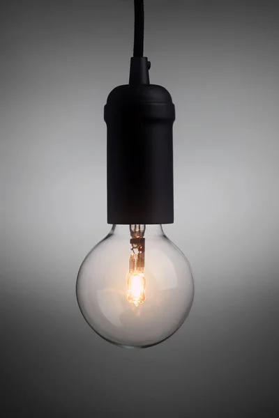 Vintage light bulb glowing — 图库照片