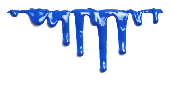 Blauwe verf druipende geïsoleerd op wit — Stockfoto