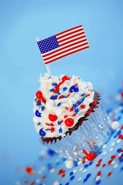 4th of July cupcake with flag and sprinkles Stock Image
