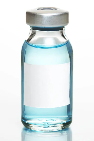 Vacuna o vial de medicamento con etiqueta blanca en blanco —  Fotos de Stock