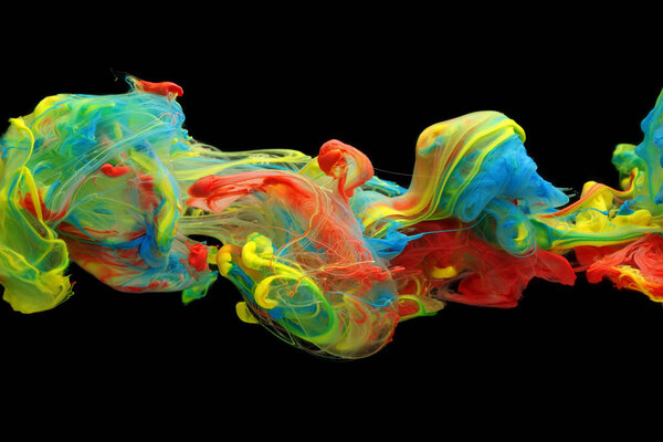 Colorful ink and paint swirling through water