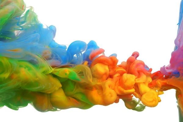 Nubes de tinta de colores brillantes mezclándose en agua — Foto de Stock