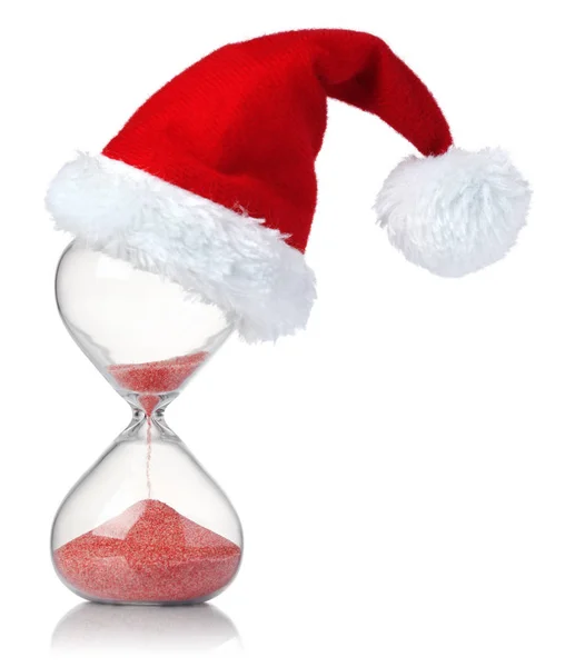 Hourglass med Christmas Santa hatt visar tidens gång — Stockfoto