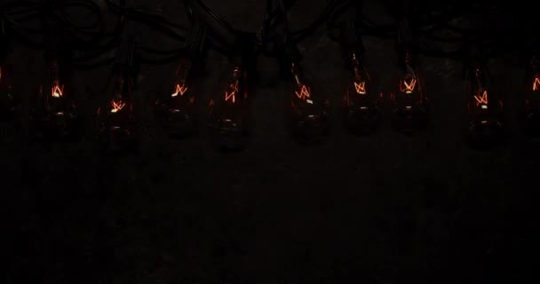 Antique String Light Bulbs Flickering Flashing Old Dark Background — Stock Video
