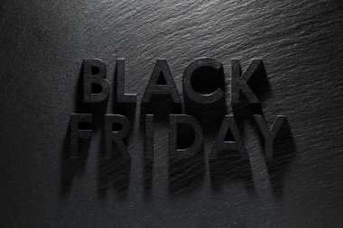 Siyah kayrak arka plan üzerinde Black Friday metin