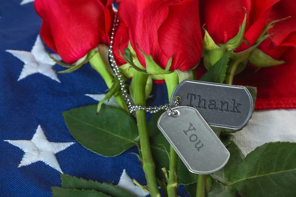 American flag with roses and military dog tags — Stock Photo, Image