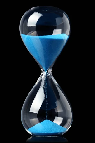 Hourglass with blue sand showing the passage of time — Stock Photo, Image