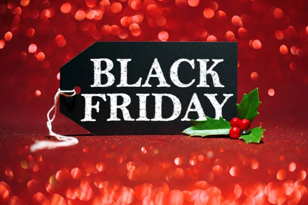 Black Friday eticheta de vânzare pe fundal sclipici roșii — Fotografie, imagine de stoc