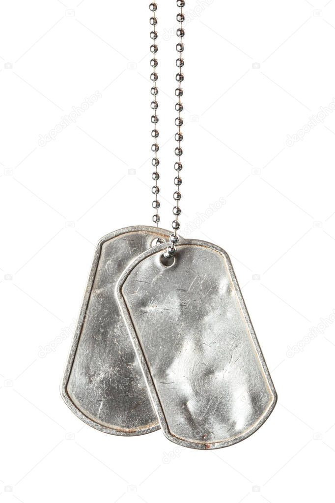Old and worn blank military dog tags with chain isolated on whit