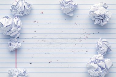 School supplies of blank lined notebook paper with eraser marks and erased pencil writing, surrounded by more trashed balled up paper. Studying or writing mistakes concept. clipart
