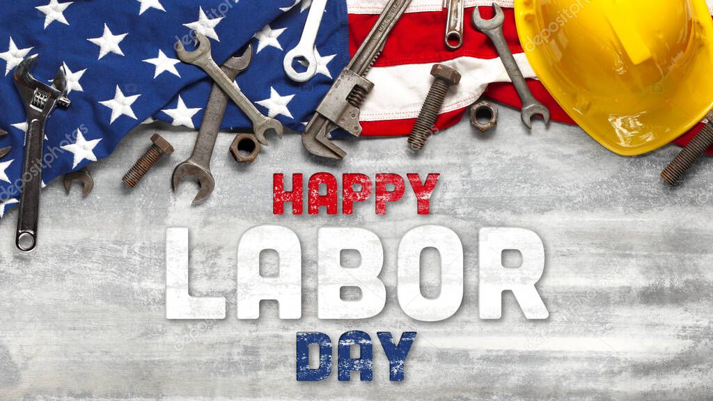 US American flag with work tools on worn white wooden background. For USA Labor day celebration. With Happy Labor Day text.