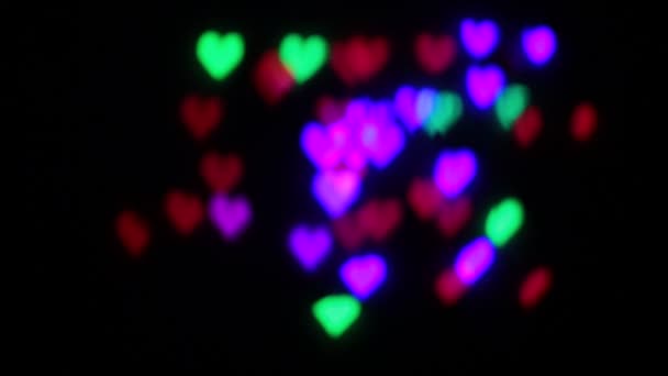 Bokeh Forma Corazones Parpadeando Diferentes Colores — Vídeos de Stock