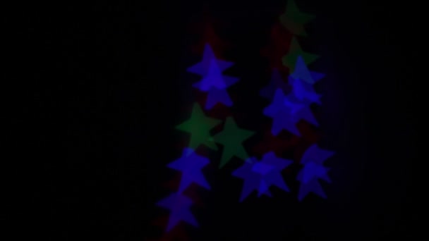 Bokeh Forma Estrella Parpadeando Diferentes Colores — Vídeo de stock