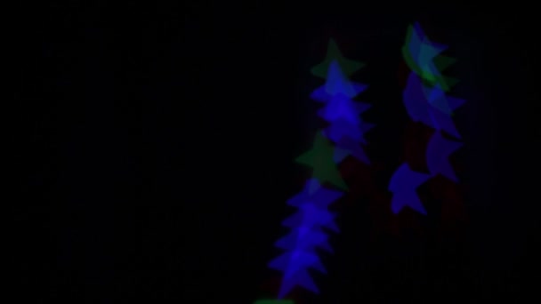 Bokeh Σχήματος Αστεριού Που Αναβοσβήνει Διαφορετικά Χρώματα — Αρχείο Βίντεο