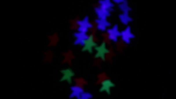 Star Shaped Bokeh Flashing Different Colors — Stock Video