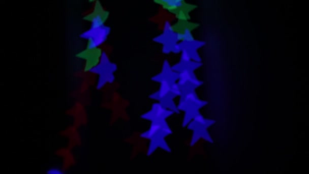 Star Shaped Bokeh Flashing Different Colors — Stock Video