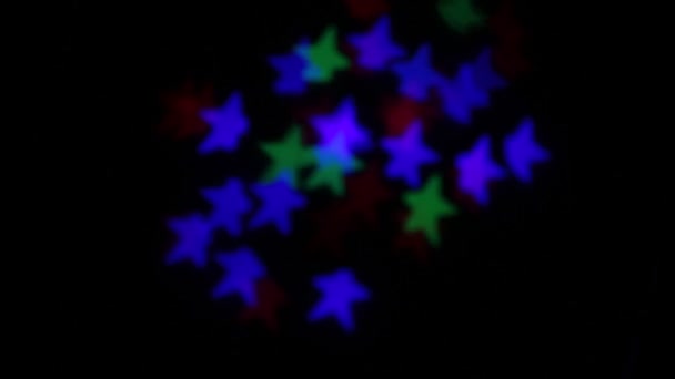 Bokeh Forma Estrella Parpadeando Diferentes Colores — Vídeo de stock