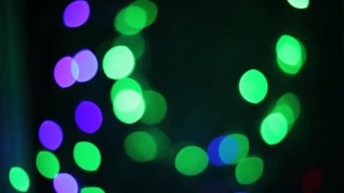 Yanıp sönen renkli daireler, alışılmadık şekil bokeh gibi çelenk