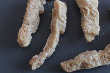 Yarı bitmiş kuru soya et vejetaryenler gıda birçok parça Sığır straganof için Vegan makro fotoğraf fasulye ürün