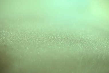 Arkaplan kumları kırılgan pullar, yanıp sönen parıldayan parıltılarla bokeh