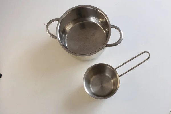 Empty kitchen utensils on white background