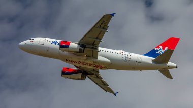 Berlin, Germany, 07.07.2018: Air Serbia Airbus A319 aircraft named after Goran Bregovic departing from Tegel Airport clipart