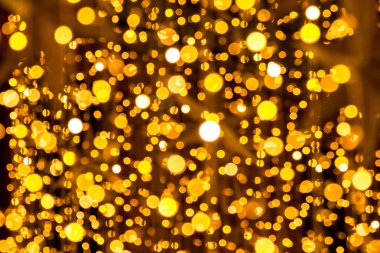 Bokeh-soyutlama: Yükselen altın ve ışıklar dairelerin bir peri