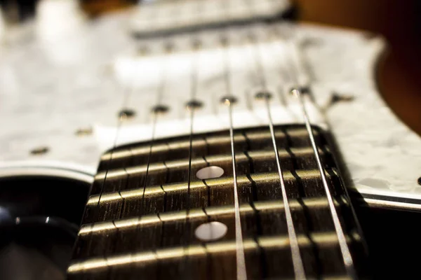 Pickups and electric guitar strings closeup