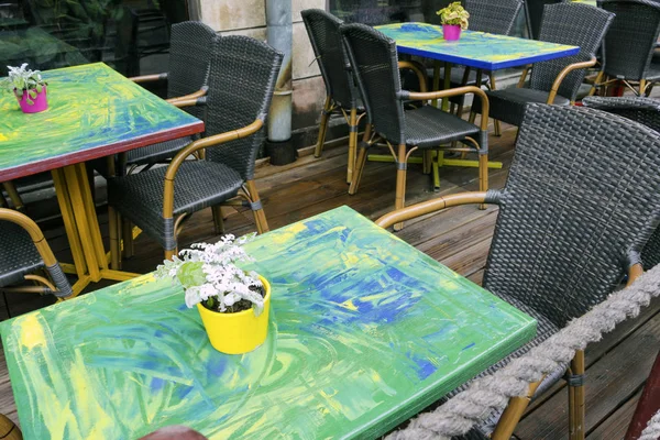 Table and chairs in a street restaurant