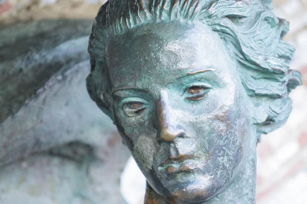 stock image face of a statue of a girl closeup