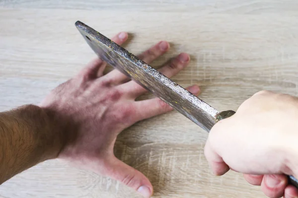 cut off one\'s fingers with an ax