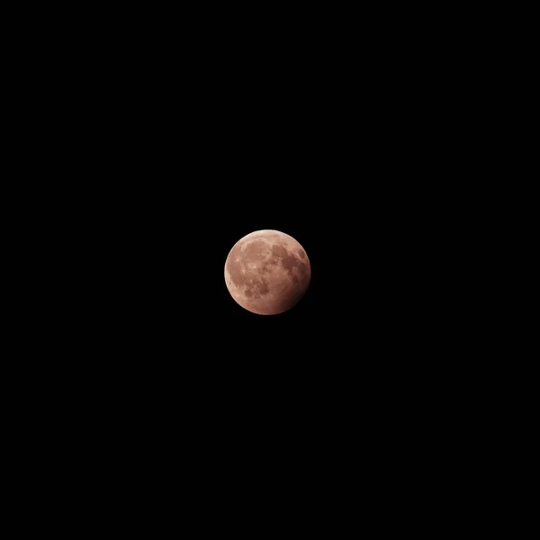 red moon in the black night sky