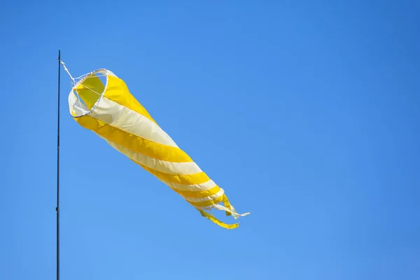 yellow flag for determining the direction of the wind
