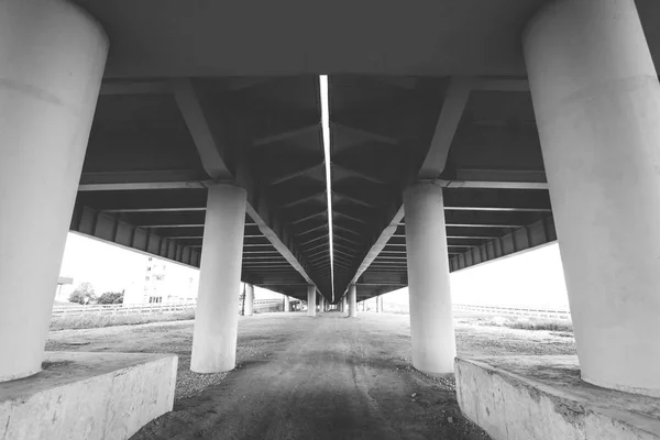 geometry of the overpass bridge, view under the bridge, black and white