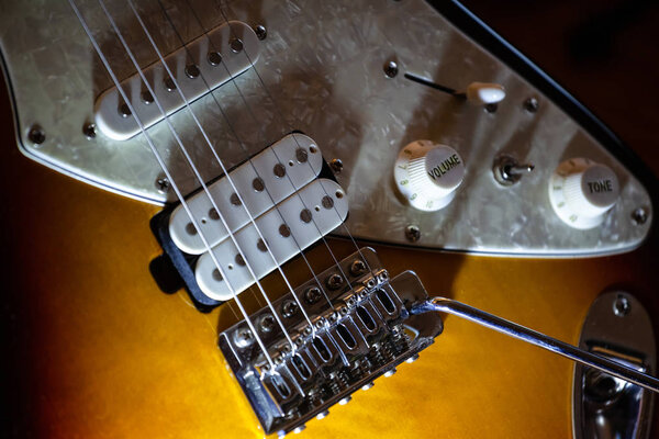 Close-up of a tobacco-colored electric guitar body