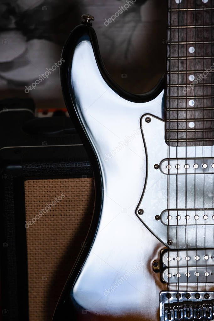 close-up shot of shiny guitar case and amplifier