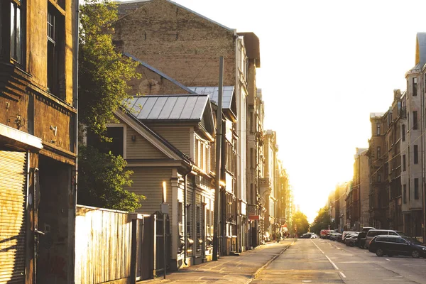 city street in perspective with a beautiful sunset in the distance, toned