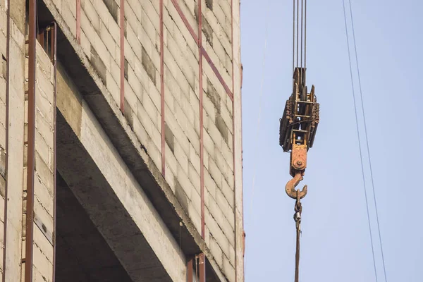 Tower crane lifts loads.work tower crane on the construction site.