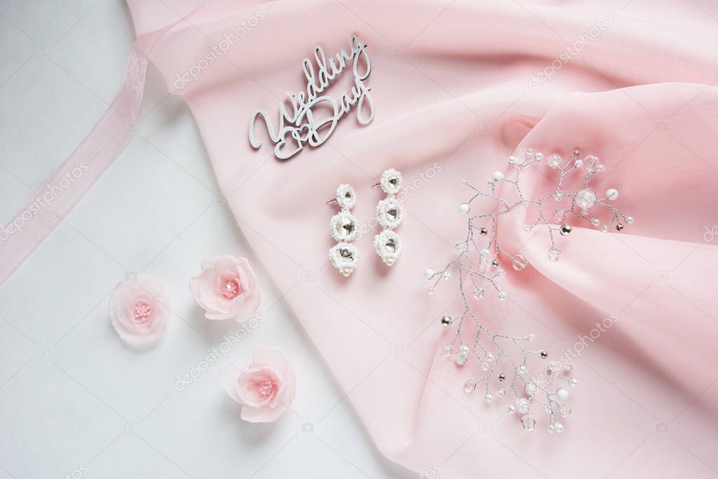 wedding wooden words, decorative fabric flowers, bridal jewelry on the pink cloth - wedding decoration content