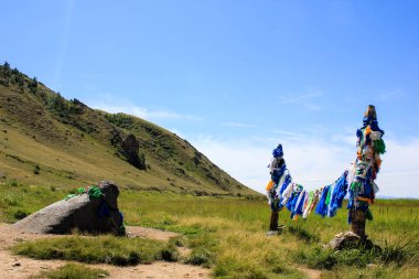 Buddhist prayer flags on ritual poles clipart