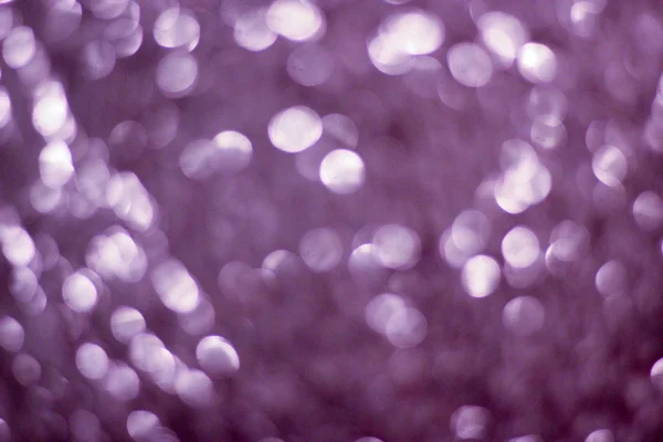 Abstracte paarse achtergrond met bokeh lichten — Stockfoto