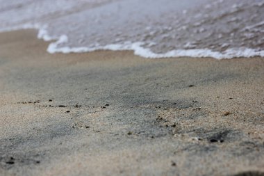 Dalga bulanık yumuşak deniz ve plaj kum kapat