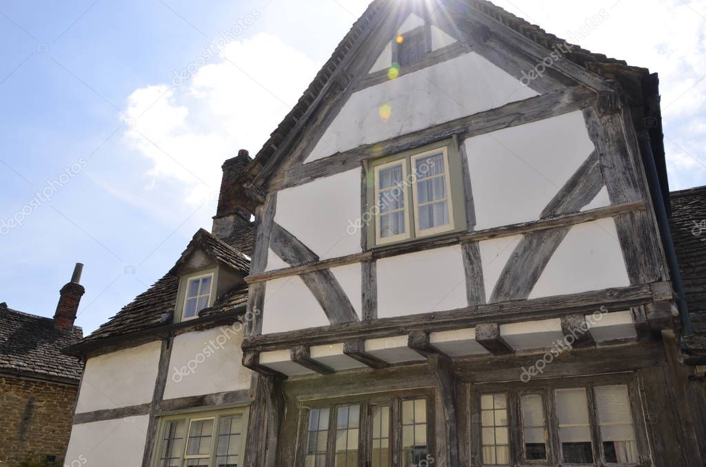 One of the preserved medeival buildings in the Wiltshire village of Lacock, England. The historic village, which is owned by the National Trust, dates back to the 13th century and has many old limewashed timber and stone houses.